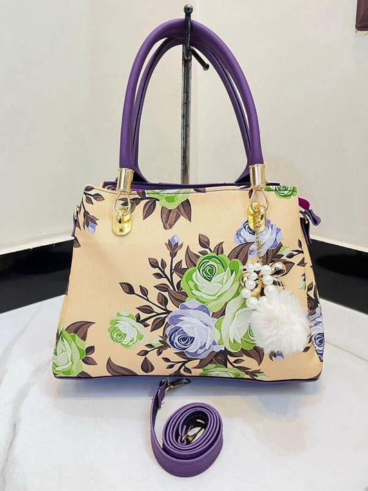 Elegant Floral Pattern Handbag with Stylish Handle and Charm Accent